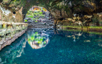 Cave pool and rock formations in Jameos del Agua, Lanzarote, Canary Islands, Spain.