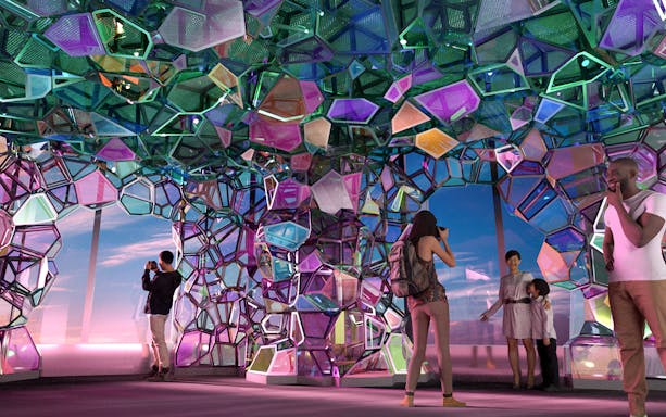 Visitors exploring the colorful geometric installation at Edge Experience, NYC.