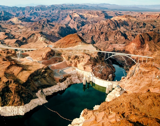 Aerial view of Hoover Dam and surrounding desert landscape, Nevada.