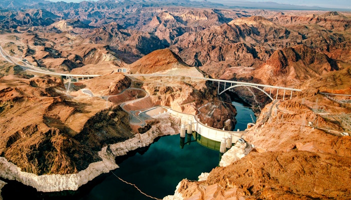 Aerial view of Hoover Dam and surrounding desert landscape, Nevada.