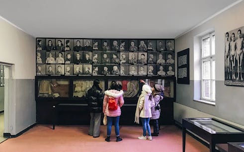 Visitors inside the Auschwitz Museum