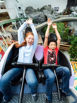 Guests enjoying a roller coaster ride at Nickelodeon Universe, Mall of America.