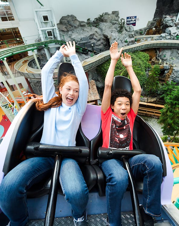 Guests enjoying a roller coaster ride at Nickelodeon Universe, Mall of America.
