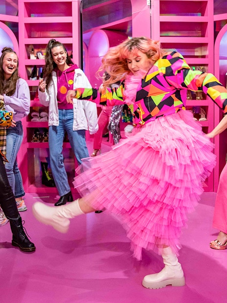 Visitors enjoying colorful room at Upside Down Amsterdam.