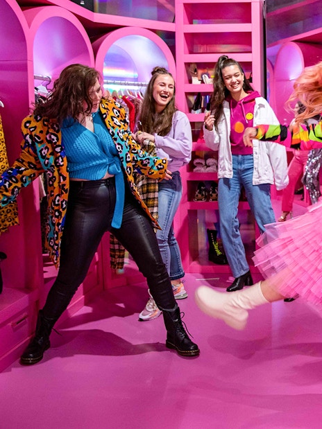 Visitors enjoying colorful room at Upside Down Amsterdam.