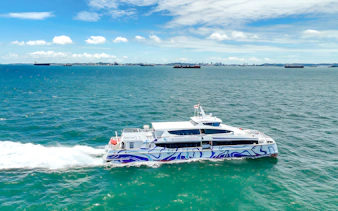 Ferry traveling from Singapore to Batam across the blue sea.