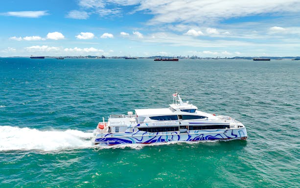 Ferry traveling from Singapore to Batam across the blue sea.