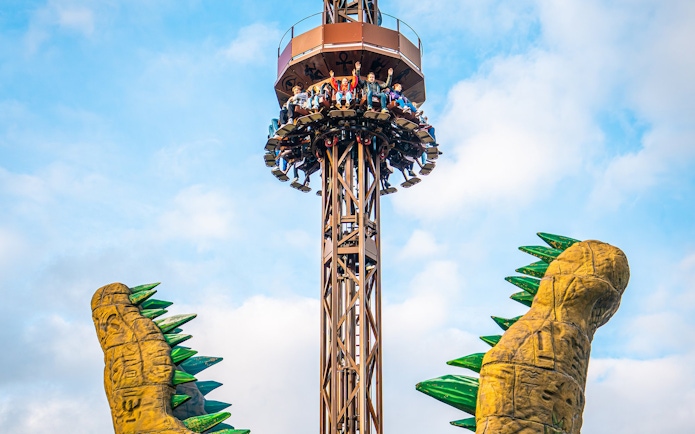 Croc Drop ride at Chessington World of Adventures, featuring a drop tower with riders descending.