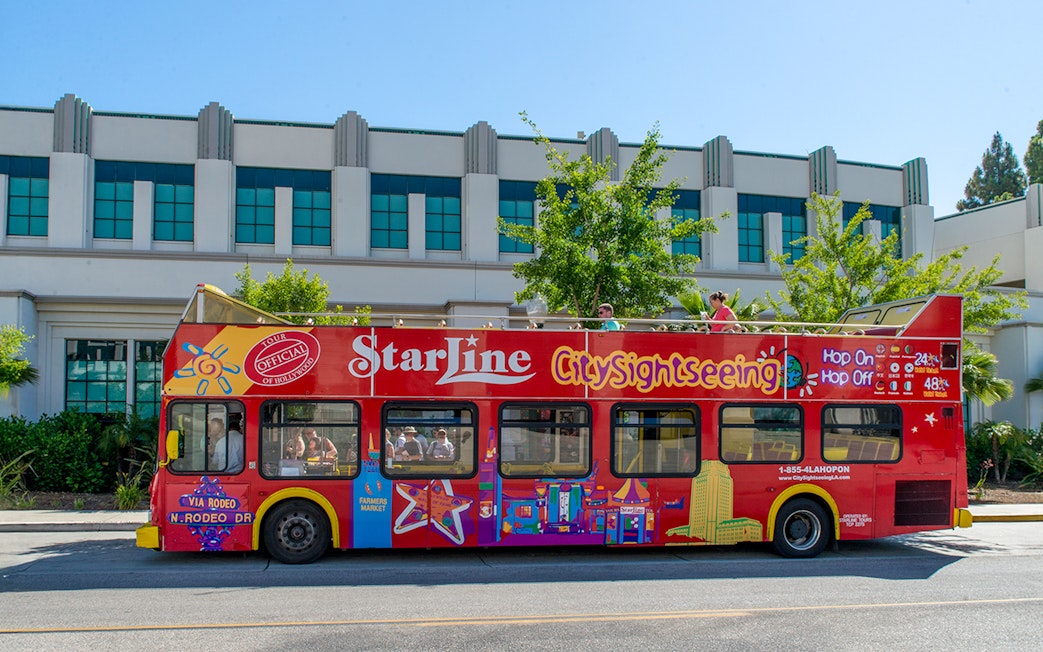 Red double-decker City Sightseeing bus in Los Angeles for hop-on hop-off tour.