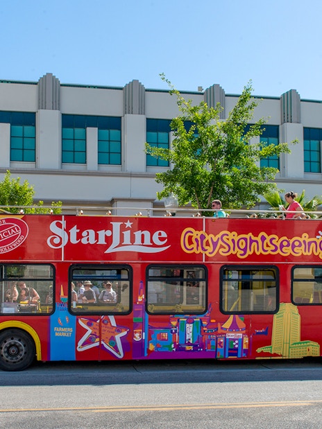 Red double-decker City Sightseeing bus in Los Angeles for hop-on hop-off tour.