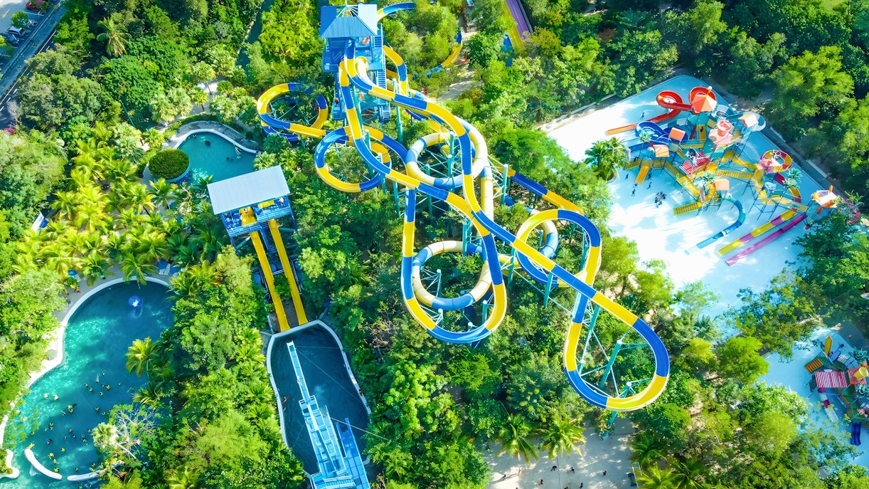 Aerial view of Escape Theme Park in Penang featuring water slides and lush greenery.