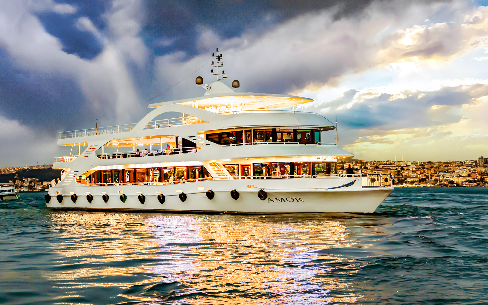 Bosphorus cruise ship sailing with cityscape in the background.