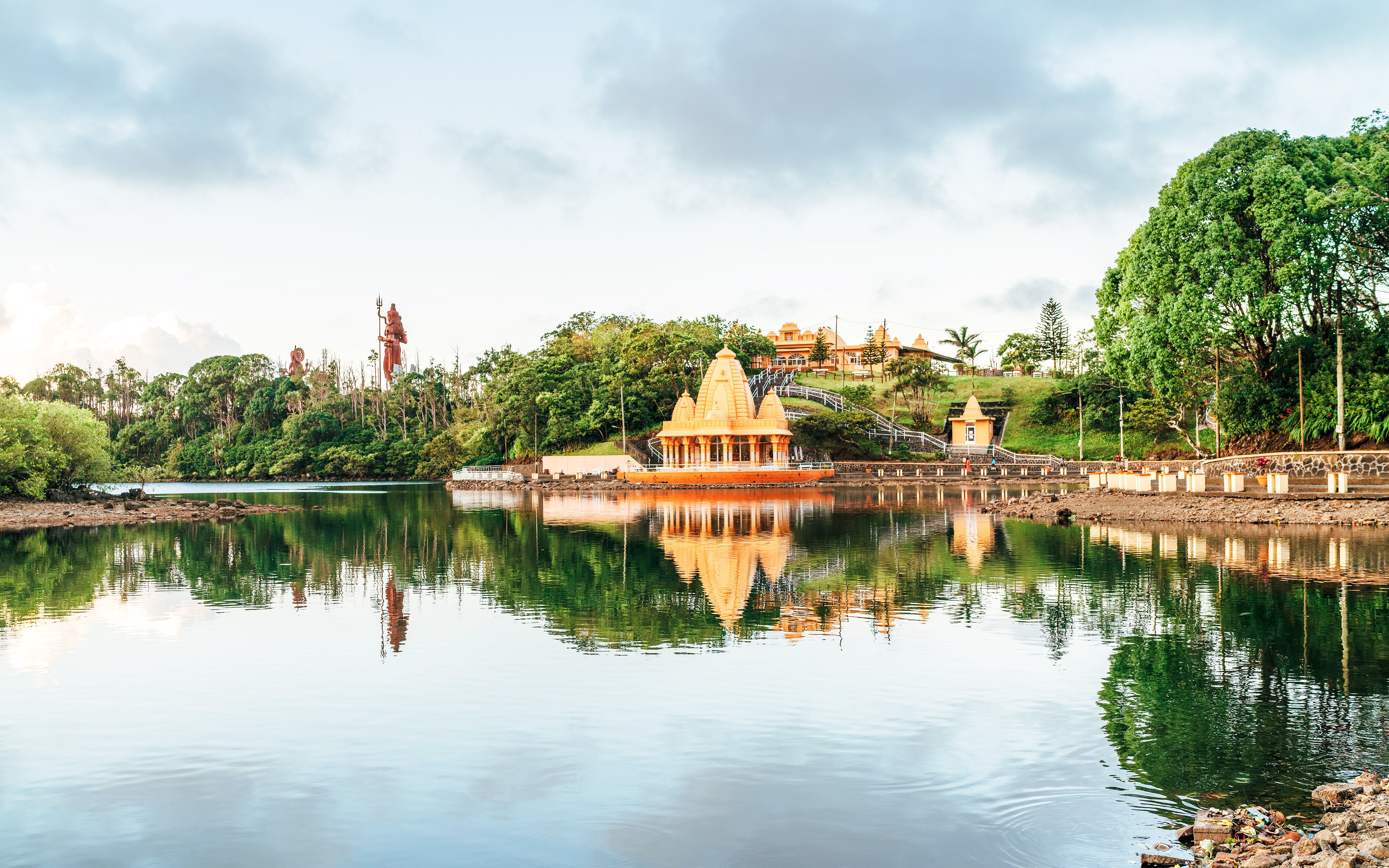 Grand Bassin Temple reflecting in the lake at Ganga Talao, Mauritius.