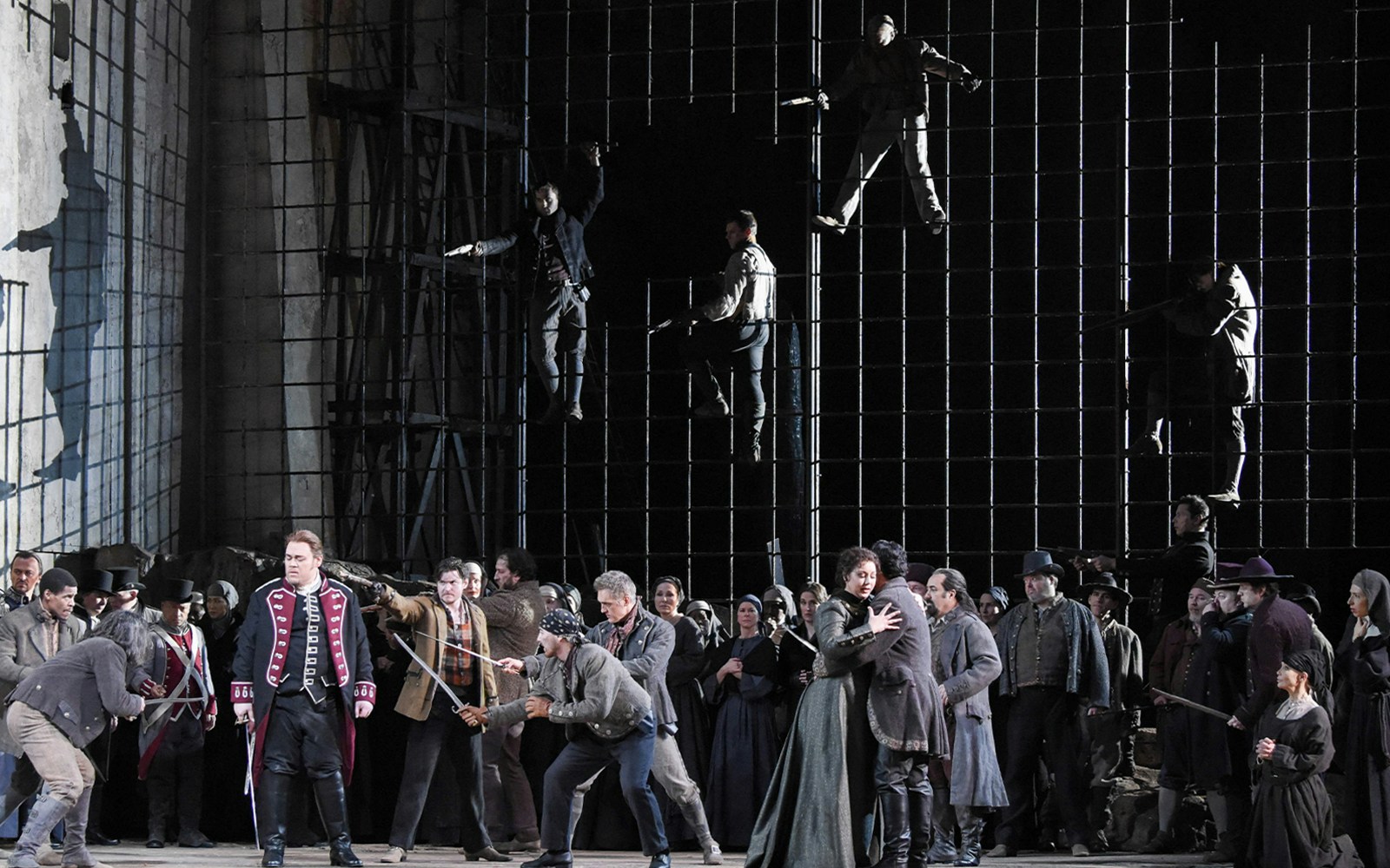 Opera scene from Il Trovatore with performers in period costumes on stage.