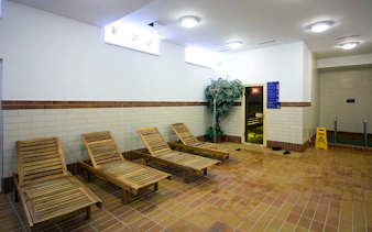 Wooden lounge chairs in the relaxation area of Dandar Spa.