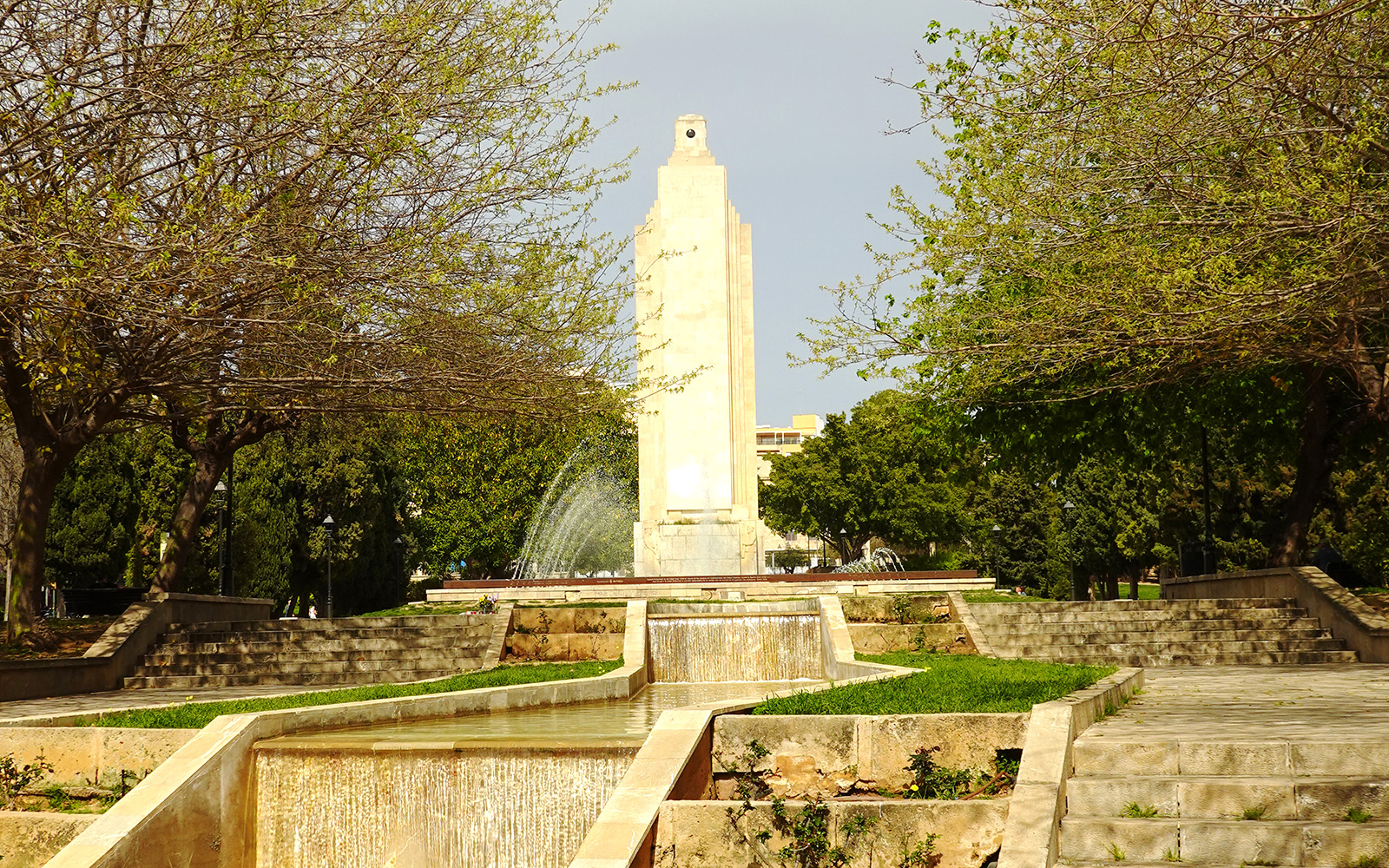Parc de Sa Feixina fountain and palm trees in Mallorca, Spain.