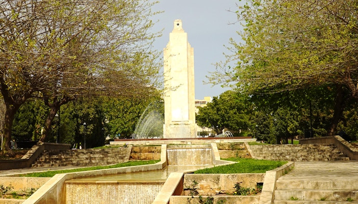 Parc de Sa Feixina fountain and palm trees in Mallorca, Spain.