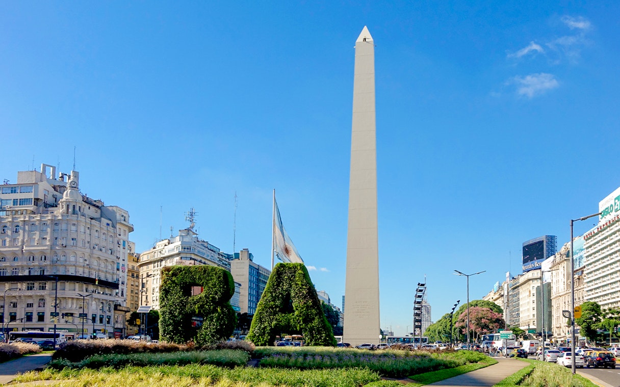 Obelisco de Buenos Aires with surrounding cityscape and greenery in Buenos Aires, Argentina.