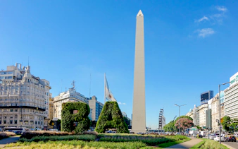 Obelisco de Buenos Aires with surrounding cityscape and greenery in Buenos Aires, Argentina.
