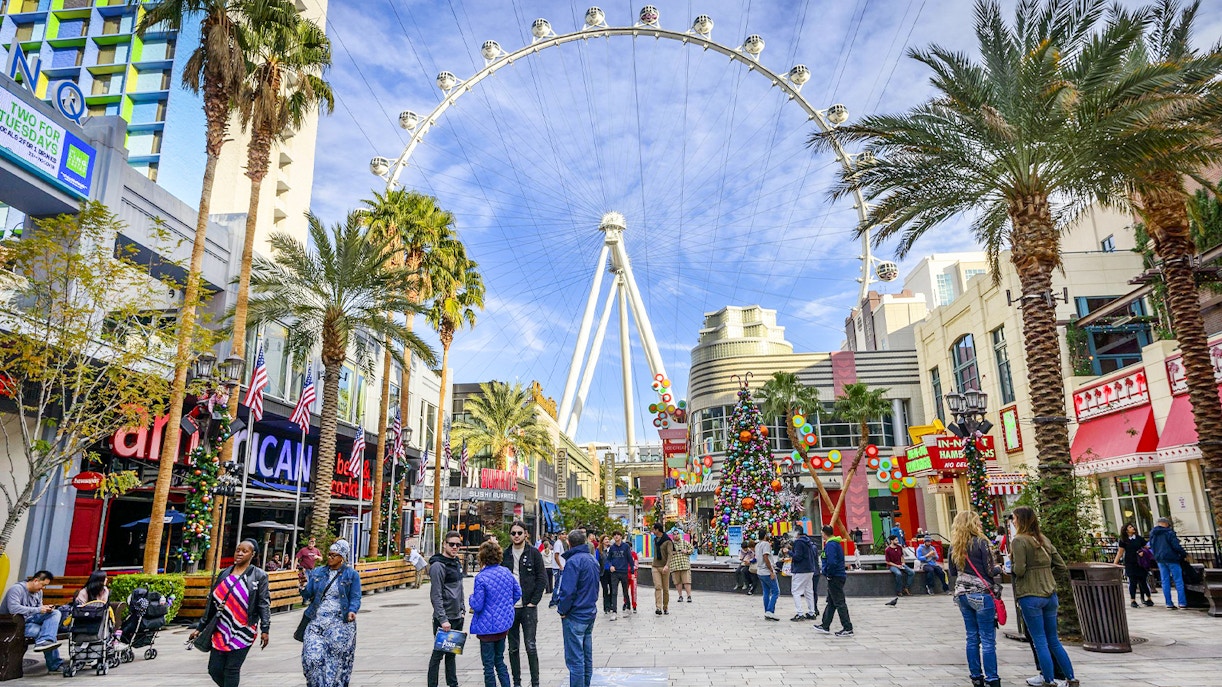 High Roller observation wheel at The LINQ, Las Vegas with people walking below.