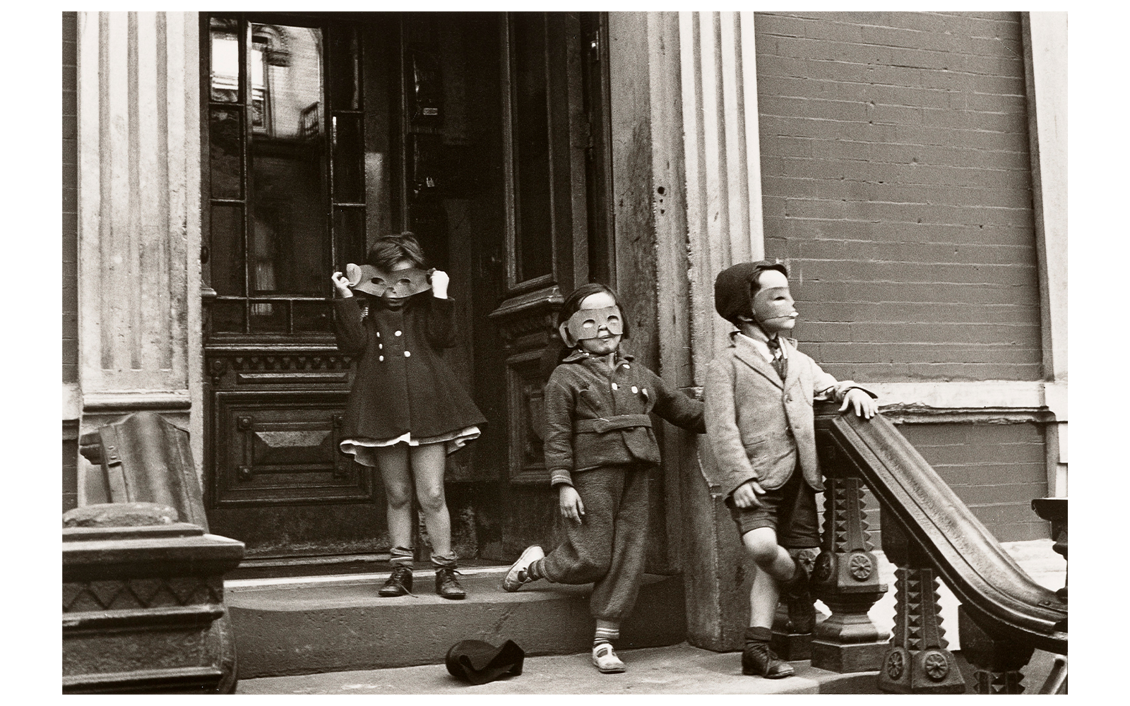 Children wearing masks on a stoop, part of the Women Photographers (1900-1975) exhibition at the National Gallery of Victoria.