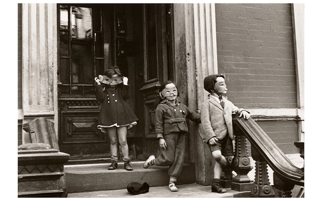 Children wearing masks on a stoop, part of the Women Photographers (1900-1975) exhibition at the National Gallery of Victoria.