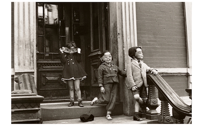 Children wearing masks on a stoop, part of the Women Photographers (1900-1975) exhibition at the National Gallery of Victoria.