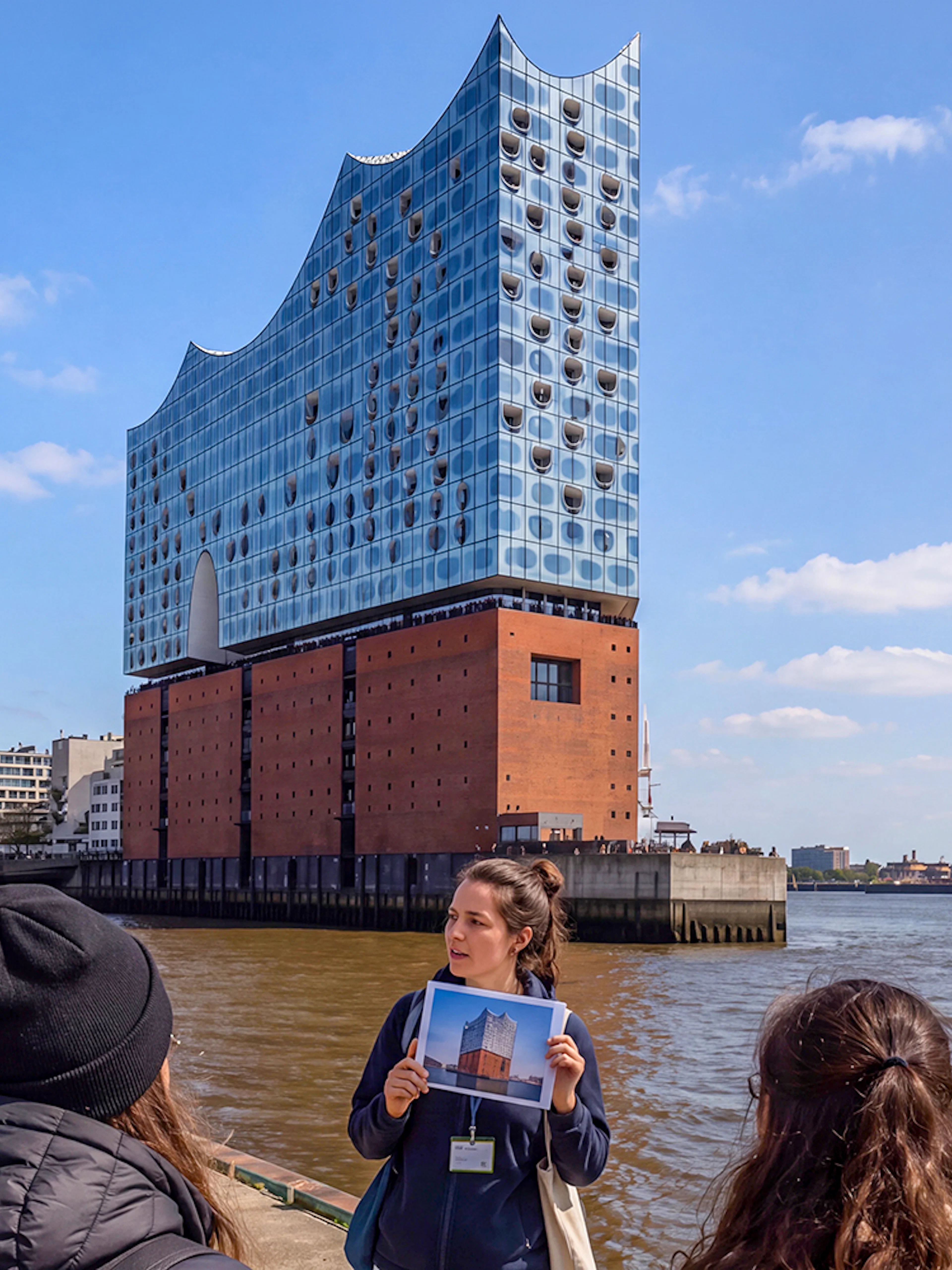 Guided tour group viewing Elbphilharmonie in Hamburg, Germany.