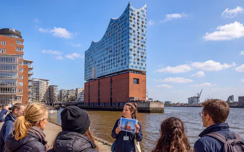 Guided tour group viewing Elbphilharmonie in Hamburg, Germany.
