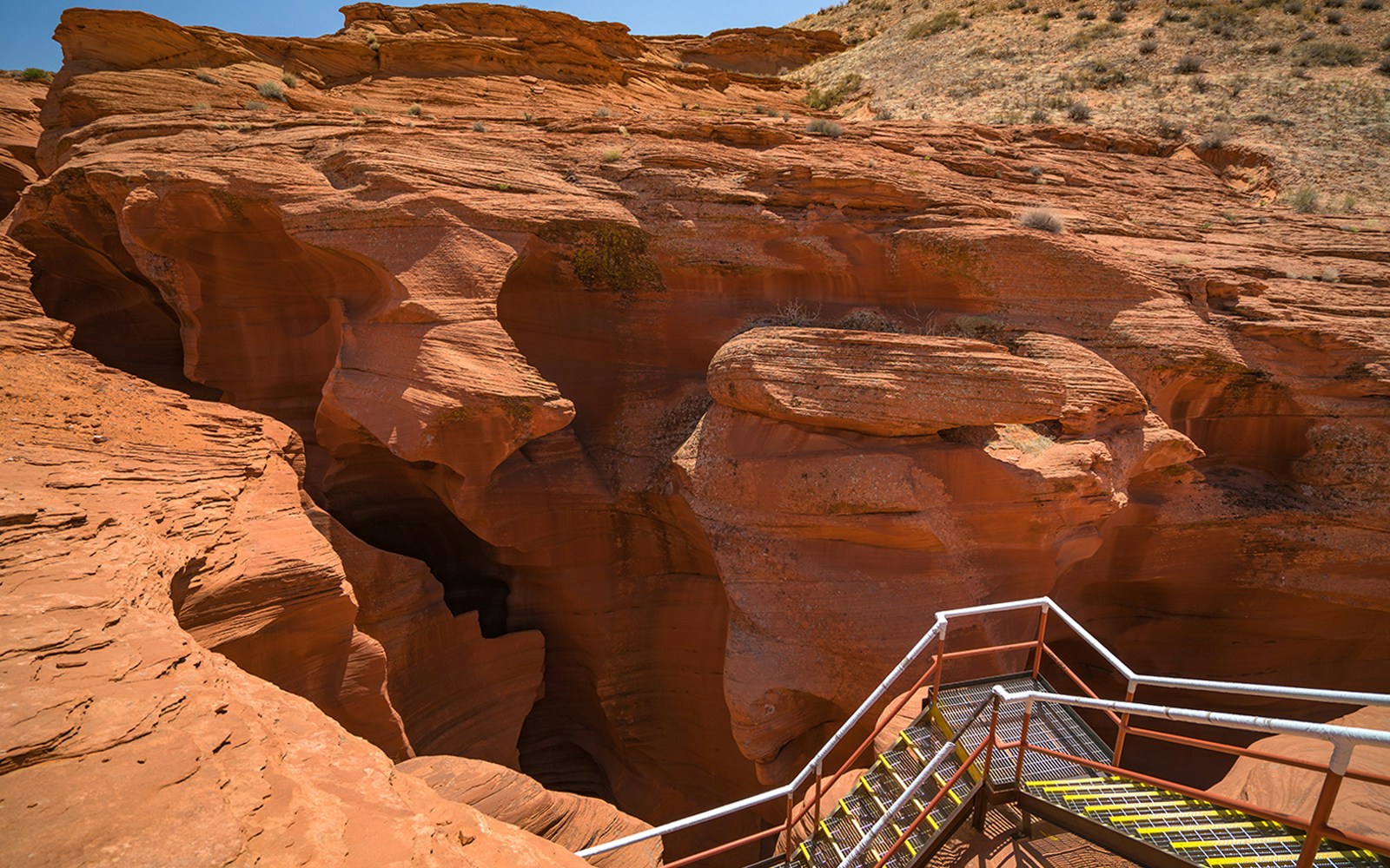 Staircase leading into the red rock formations of Antelope Canyon, Arizona.