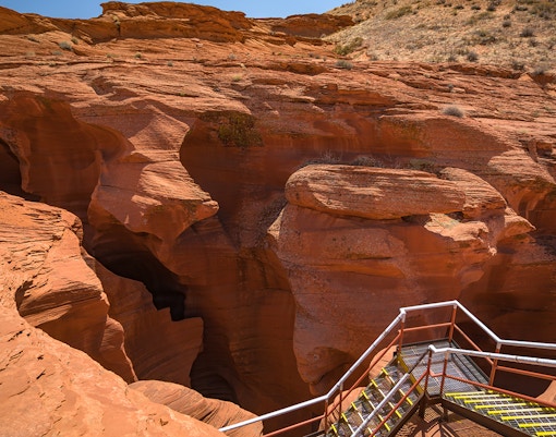 Staircase leading into the red rock formations of Antelope Canyon, Arizona.