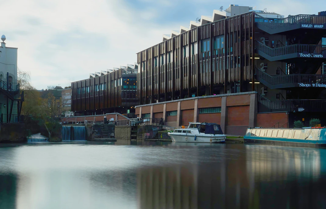 Hawley Wharf London with canal boats and modern buildings along the water.