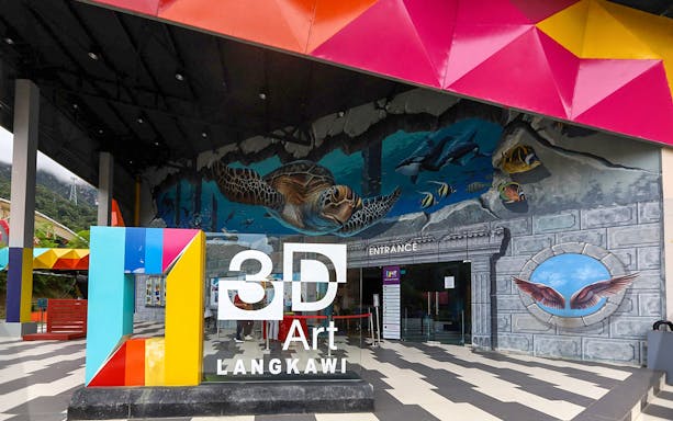 Entrance of 3D Art Museum Langkawi with colorful mural and signage.