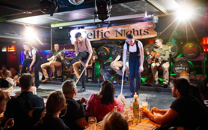 Dublin Celtic Nights show with musicians and dancers performing on stage.