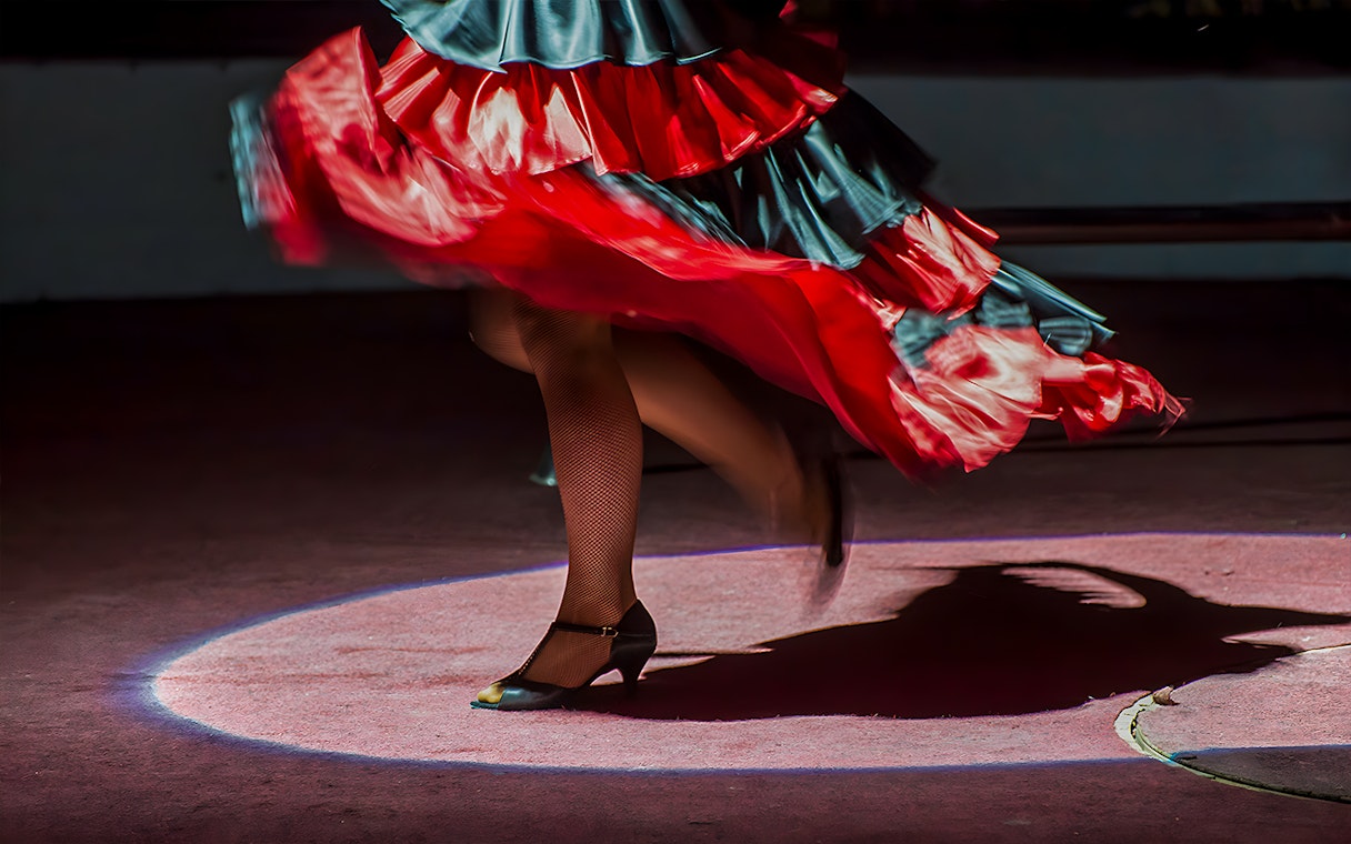 Flamenco dancer's feet in motion at Tablao El Arenal, Seville.