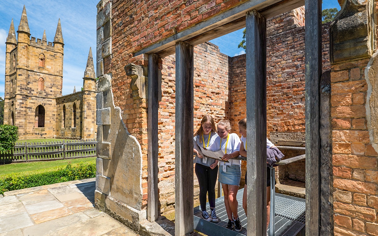 Visitors exploring Government Cottage at Port Arthur Historic Site, Tasmania.