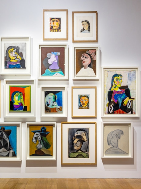 Picasso Museum art display with various framed paintings and sketches.