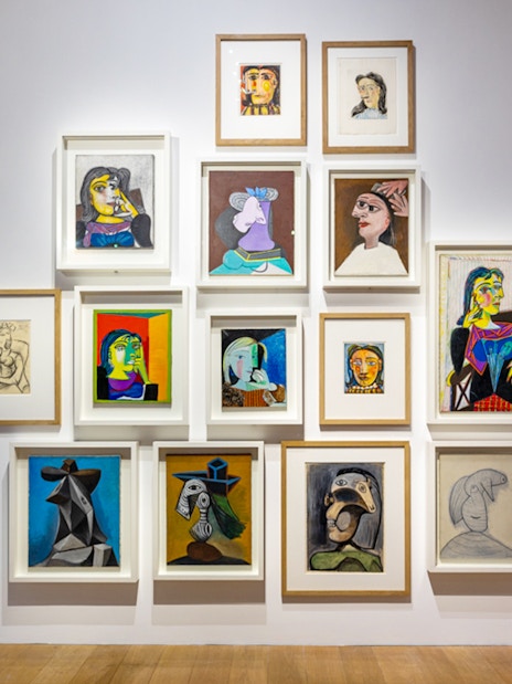 Picasso Museum art display with various framed paintings and sketches.