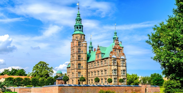 Rosenborg Castle with green spires and brick facade in Copenhagen, Denmark.