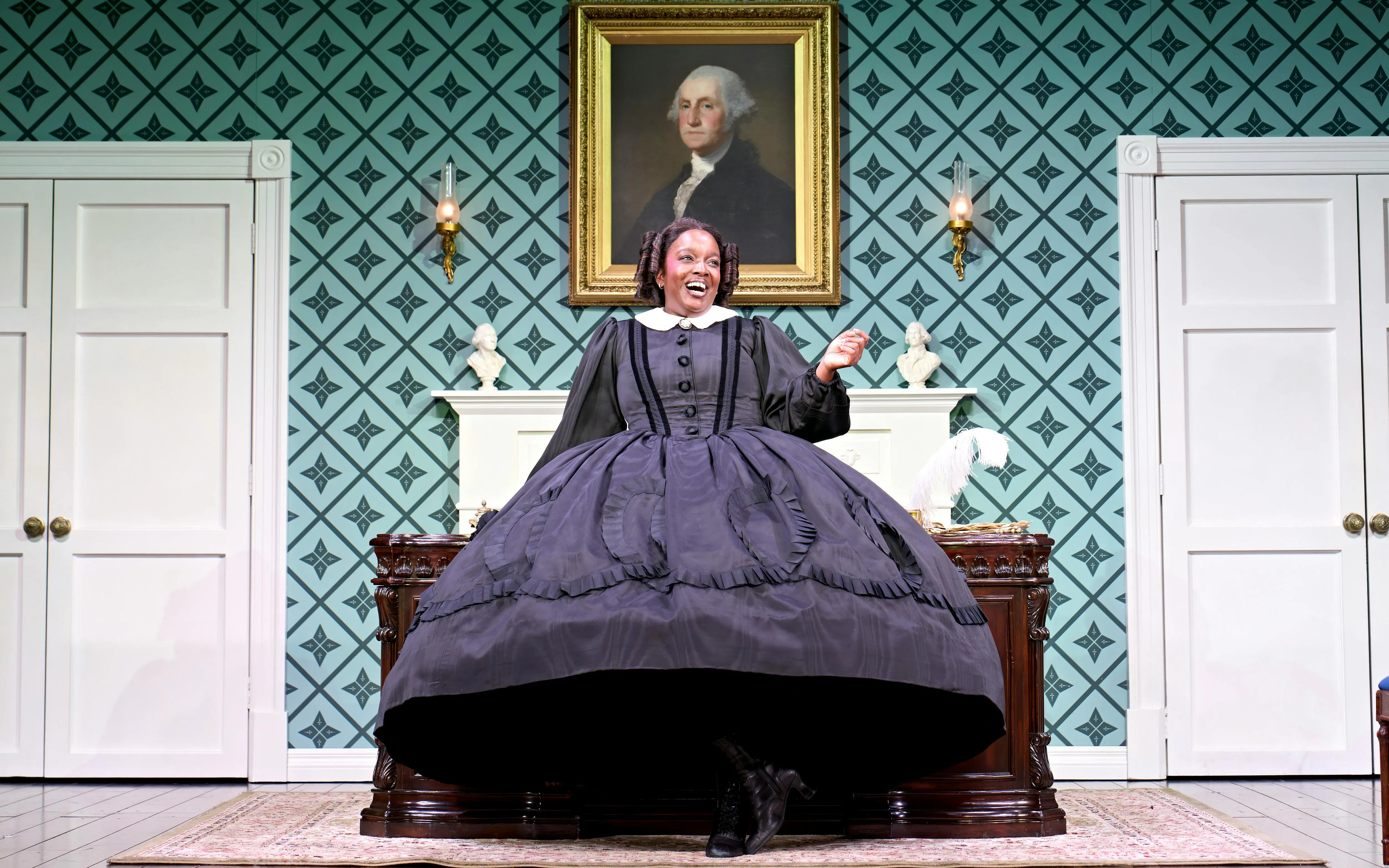 Performer in period costume on stage in "Oh Mary" at West End theater.