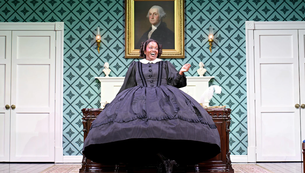 Performer in period costume on stage in "Oh Mary" at West End theater.
