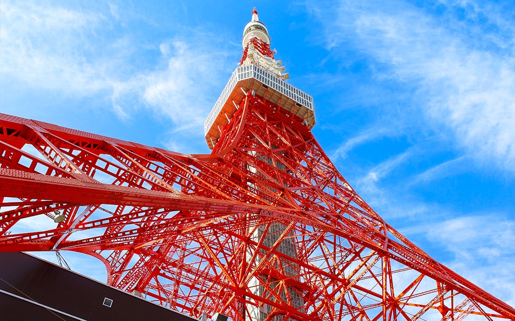 Tokyo Tower against blue sky, part of 24-hour Tokyo subway ticket combo.