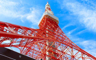 Tokyo Tower against blue sky, part of 24-hour Tokyo subway ticket combo.