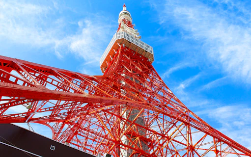 Tokyo Tower against blue sky, part of 24-hour Tokyo subway ticket combo.