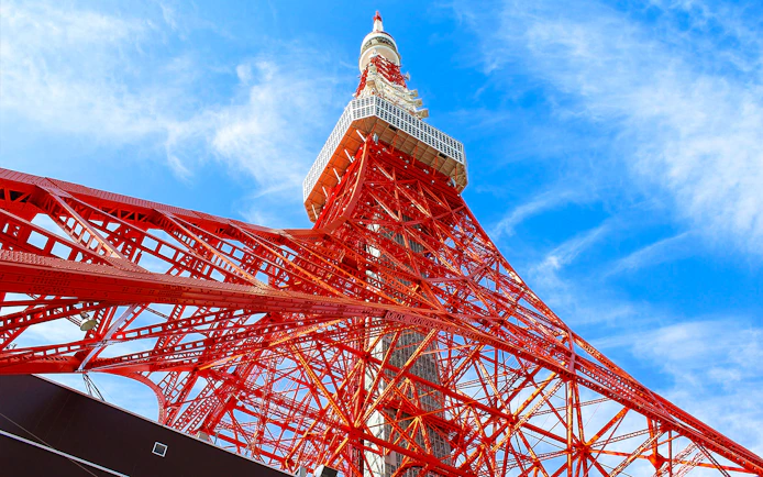Tokyo Tower against blue sky, part of 24-hour Tokyo subway ticket combo.