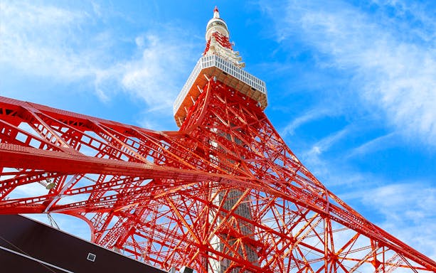 Tokyo Tower against blue sky, part of 24-hour Tokyo subway ticket combo.