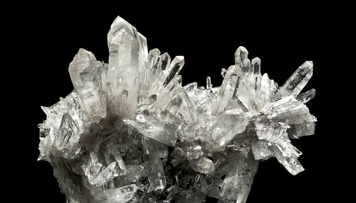 Quartz crystal cluster displayed in a museum exhibit.