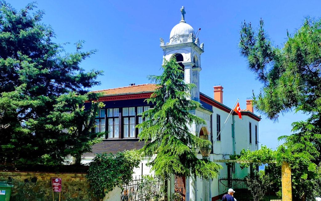 Aya Yorgi Church with bell tower and Turkish flag, Princes Island, Istanbul.