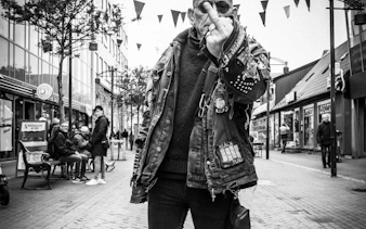 Reykjavik street with punk fashion enthusiast during music history tour.