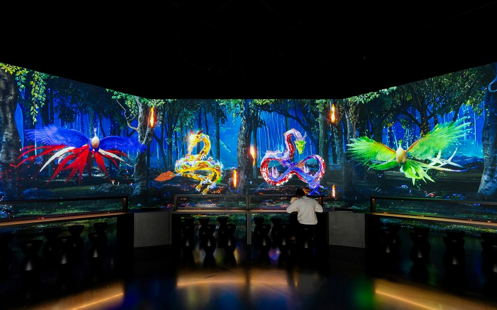 Digital art display of colorful creatures at LIVE SKETCHBOOK GUARDIANS, Arte Museum, New York.